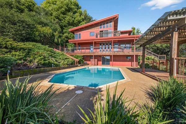 a view of a house with a swimming pool
