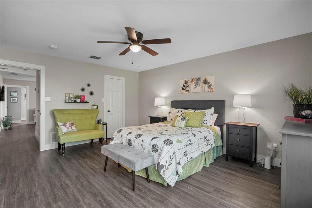 5113 Mountain Spring Trail Fort Worth, TX 76123 - Photo 27 of 35 a bedroom with a bed and wooden floor