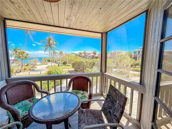 a large kitchen with stainless steel appliances kitchen island granite countertop a large kitchen island a stove a sink a dining table and chairs
