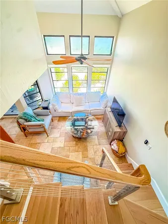 a kitchen with stainless steel appliances granite countertop a sink a stove a refrigerator a washer and dryer