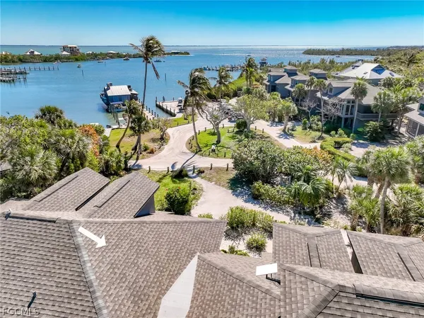 a view of a lake with couches and city view