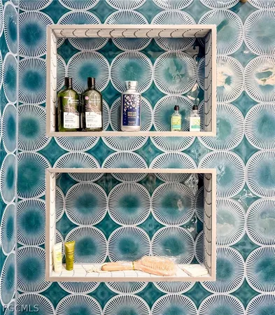 a bathroom with a shower and a sink
