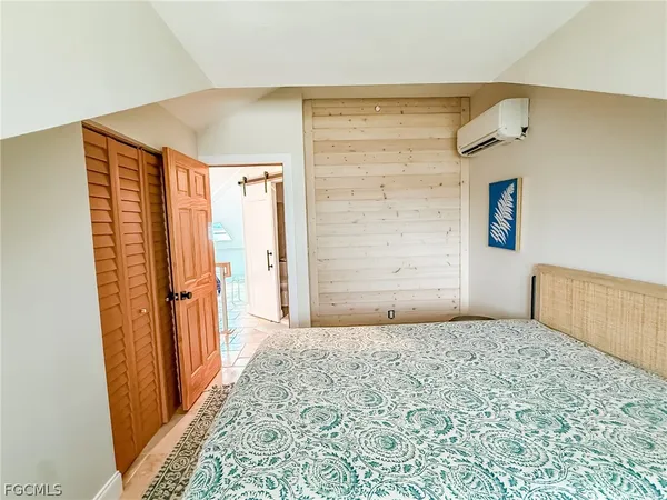 an aerial view of residential houses with outdoor space and swimming pool