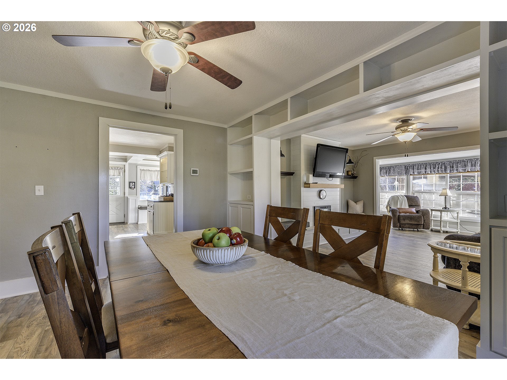 58059 Shadley Lane Warren, OR 97053 - Photo 12 of 39 a view of a dining room and livingroom with furniture wooden floor a chandelier