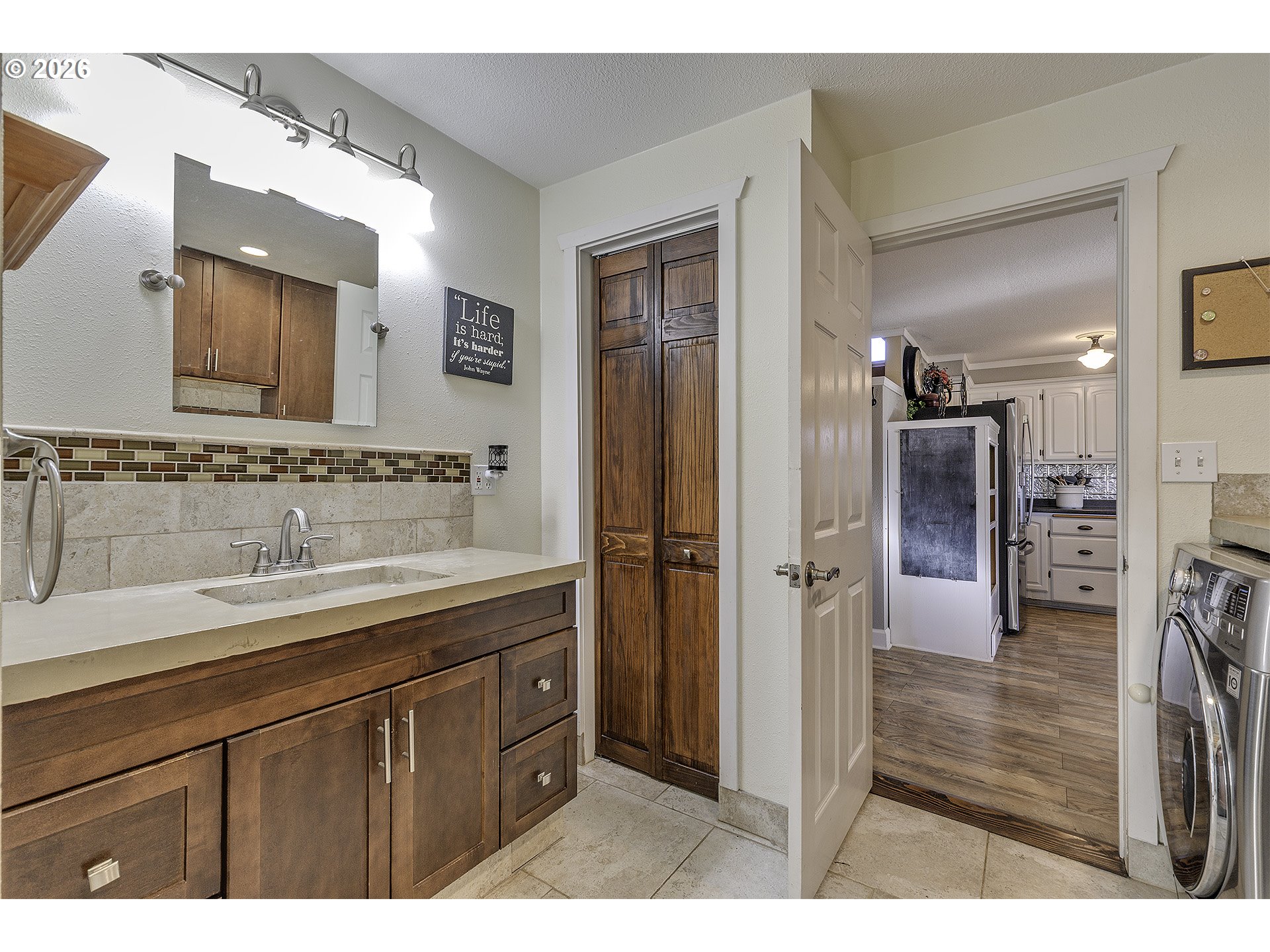 58059 Shadley Lane Warren, OR 97053 - Photo 16 of 39 a bathroom with a sink and a mirror
