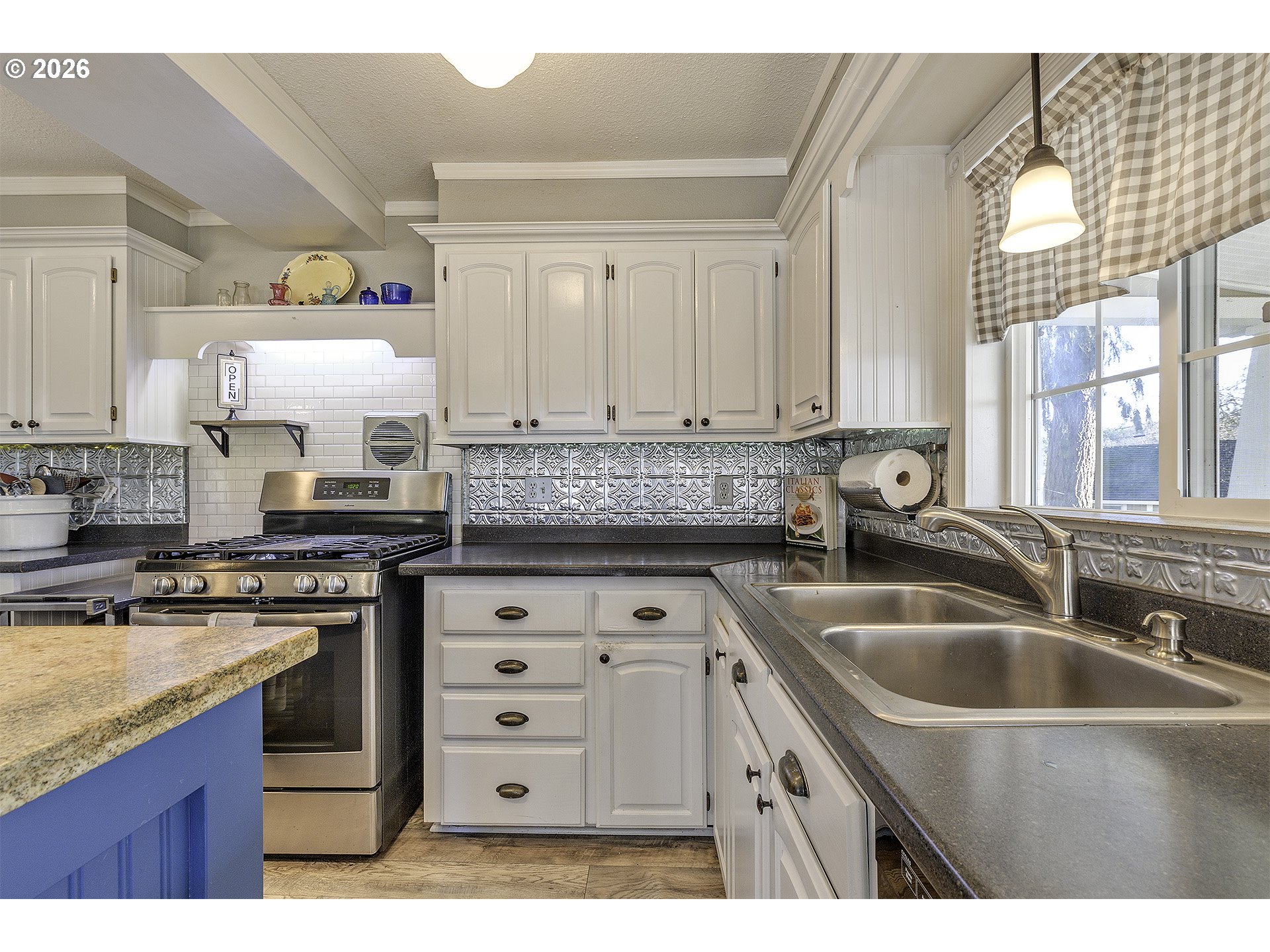 58059 Shadley Lane Warren, OR 97053 - Photo 9 of 39 a kitchen with cabinets appliances a sink and a counter top space