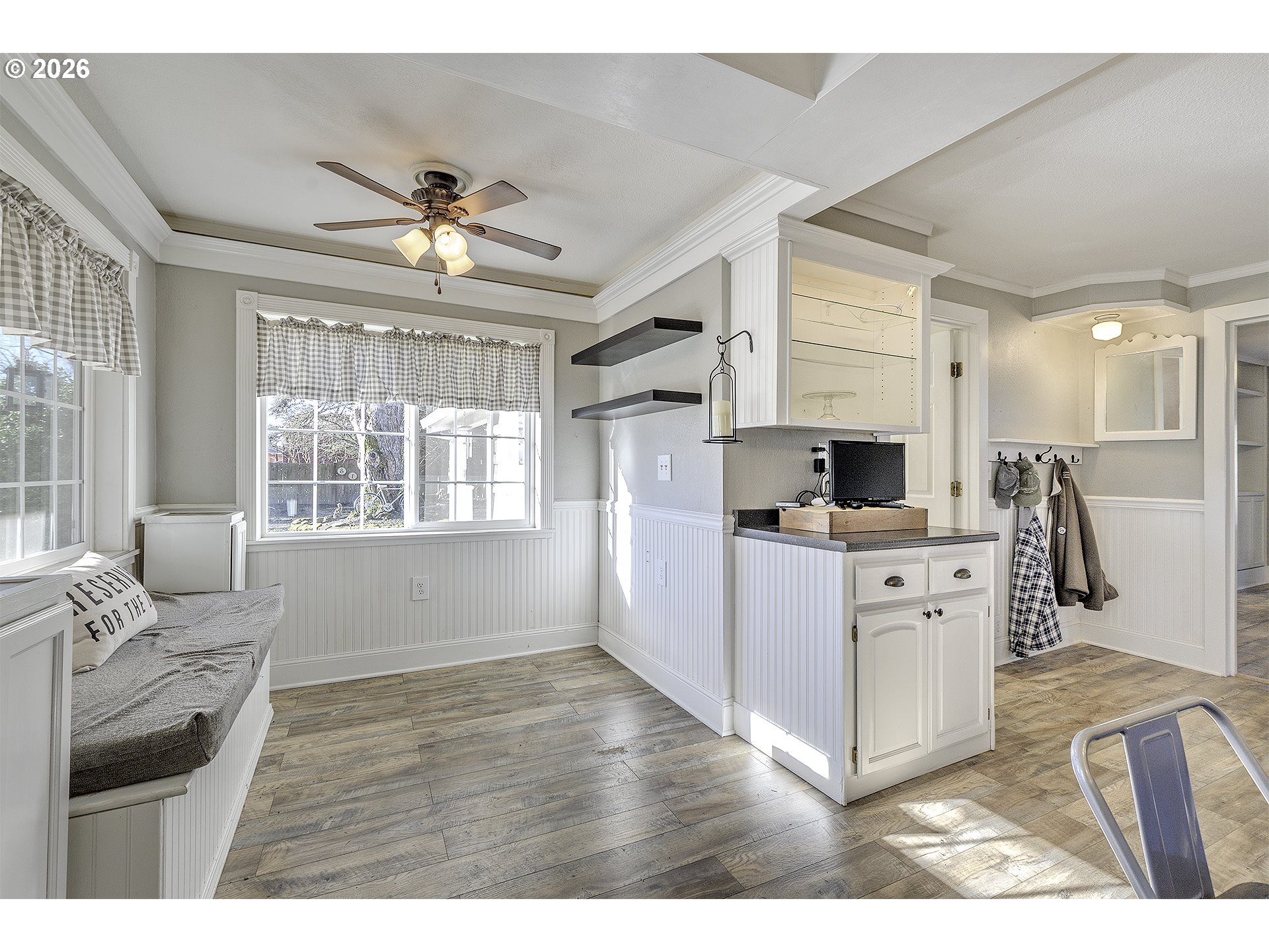 58059 Shadley Lane Warren, OR 97053 - Photo 10 of 39 a kitchen with stainless steel appliances kitchen island granite countertop a refrigerator oven a sink dishwasher and white cabinets with wooden floor