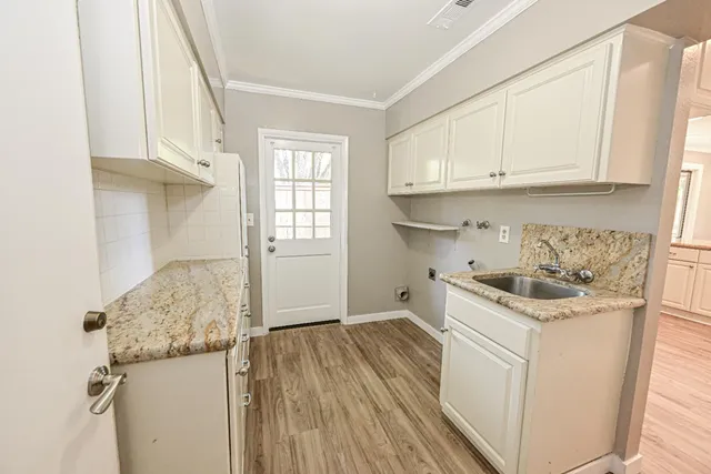 a view of backyard with seating area and green space