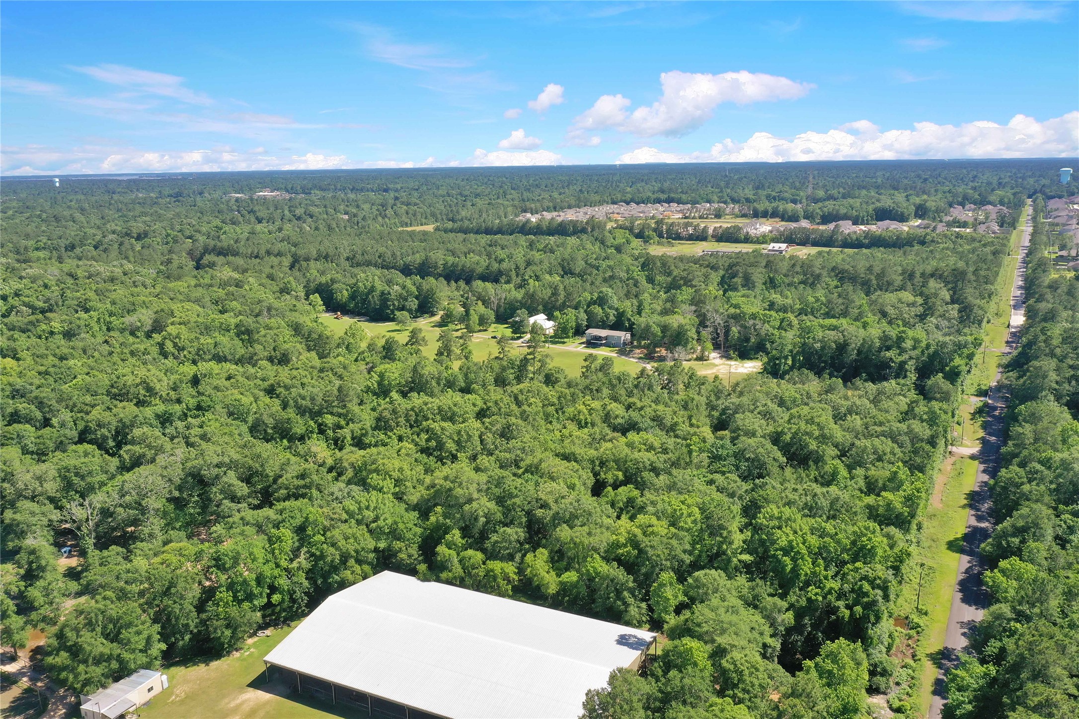 Tbd Hueni Road Porter, TX 77365 - Photo 14 of 19 a view of a city with lush green forest