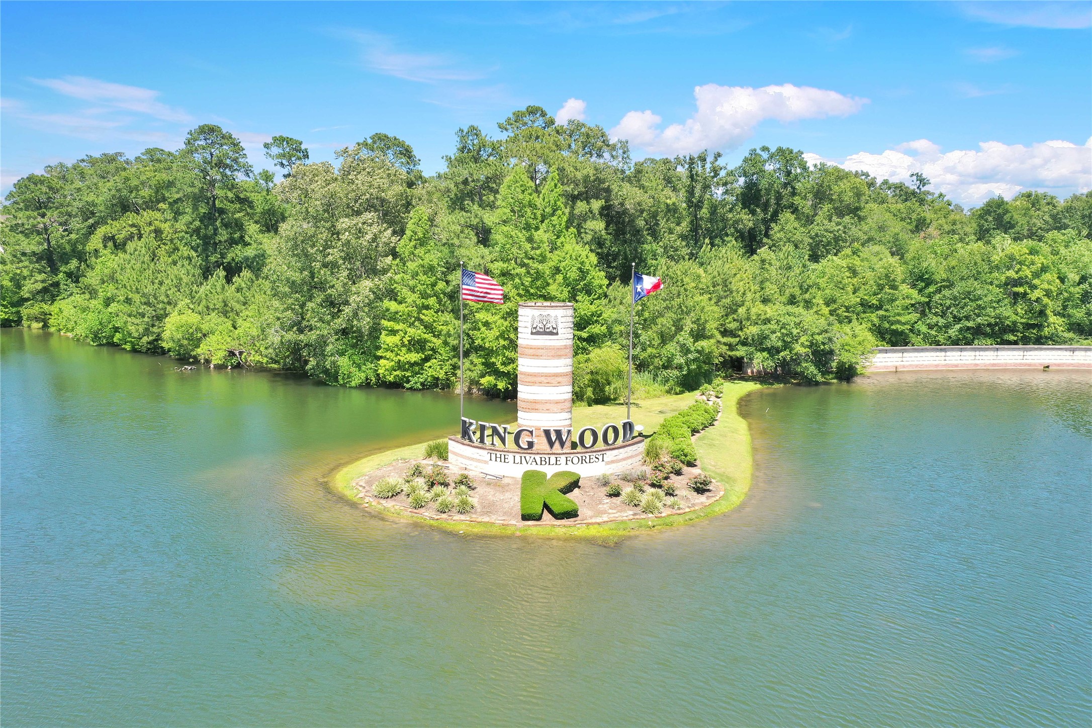 Tbd Hueni Road Porter, TX 77365 - Photo 17 of 19 a water fountain in the middle of a lake