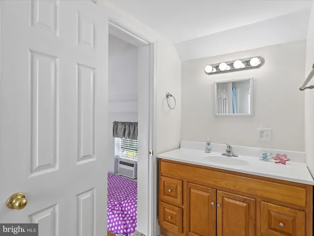 a view of a house with a patio and a yard