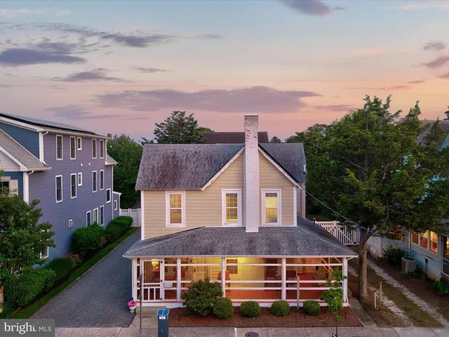 an aerial view of residential houses with city view