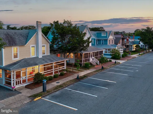 a living room with furniture fireplace and a large window