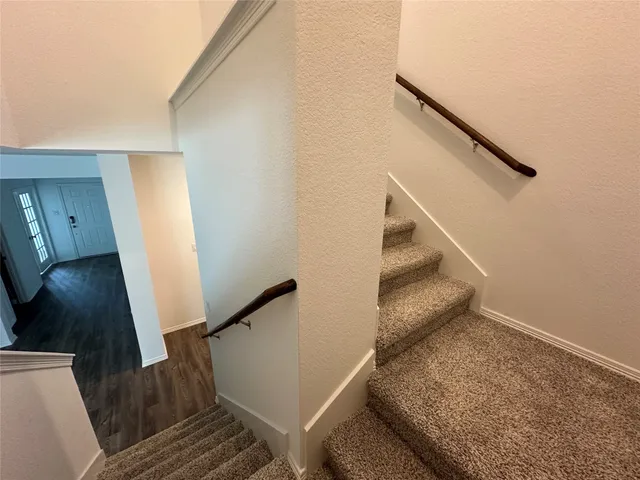 a view of entryway and kitchen
