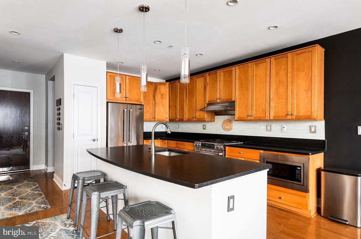 1418 North Rhodes Street, Unit B426 Arlington, VA 22209 - Photo 6 of 36 Bar counter seating island