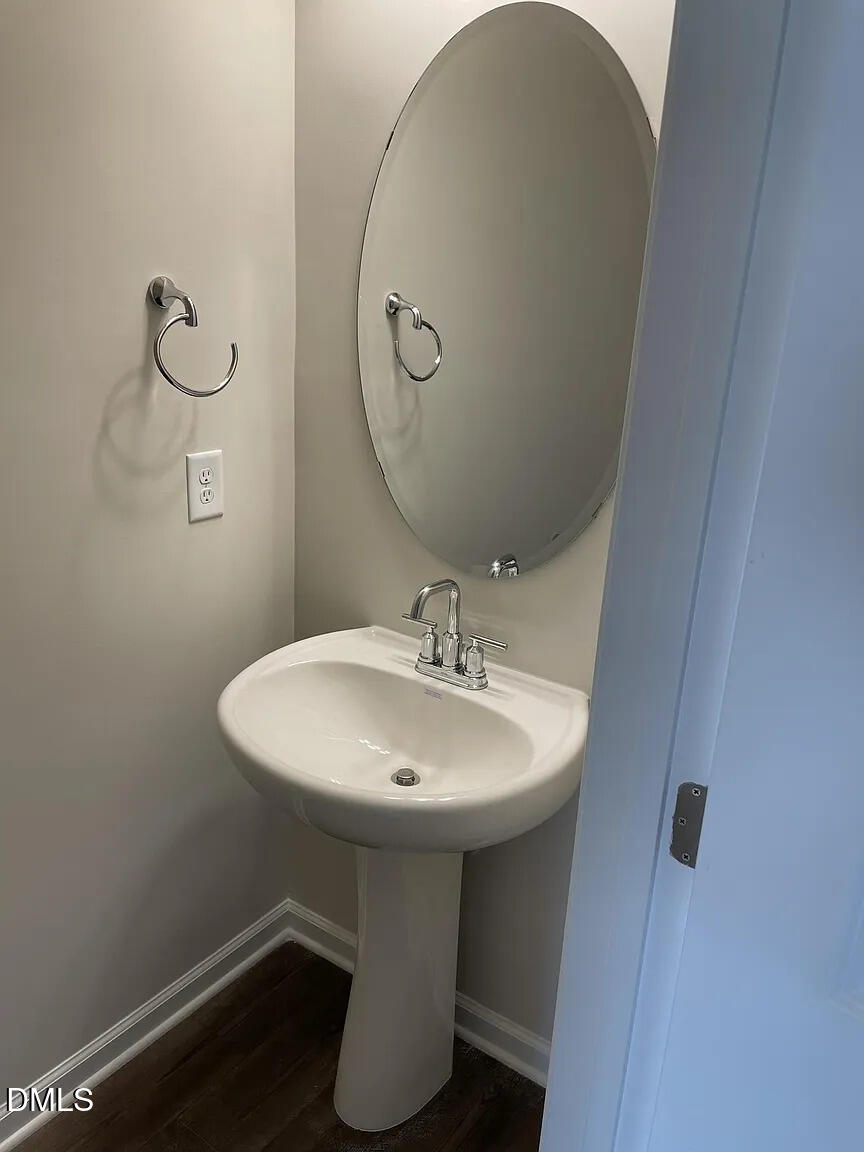 930 Field Ivy Drive Fuquay-Varina, NC 27526 - Photo 12 of 29 a bathroom with a sink and mirror