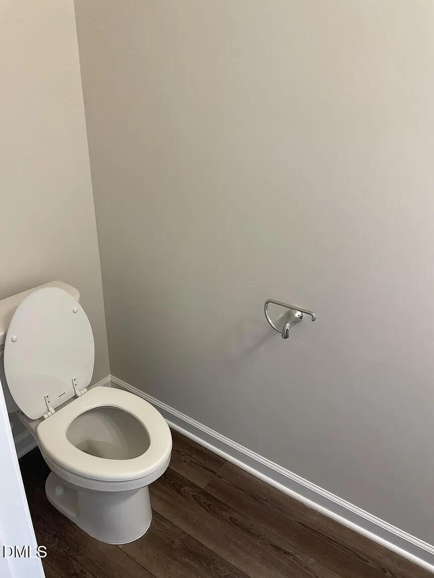 930 Field Ivy Drive Fuquay-Varina, NC 27526 - Photo 13 of 29 a white toilet sitting next to a small white sink