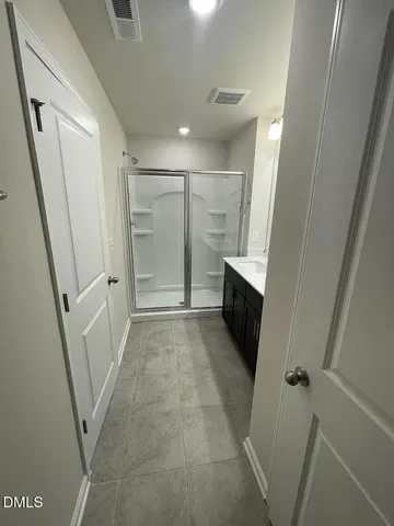 a view of gallery with wooden floor