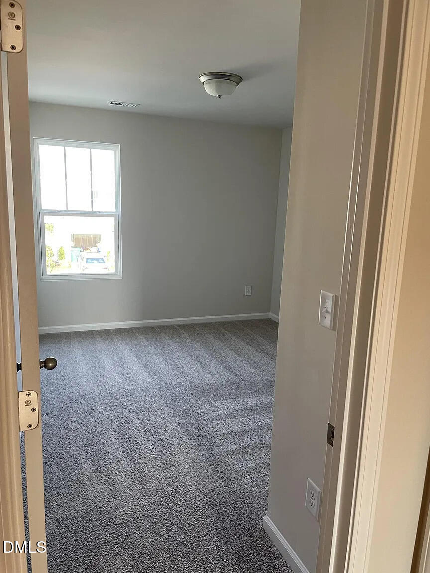 930 Field Ivy Drive Fuquay-Varina, NC 27526 - Photo 23 of 29 a view of room with window