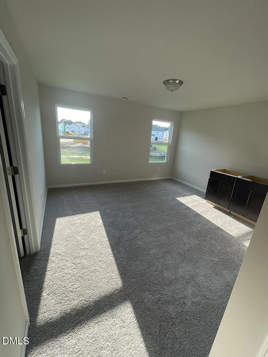 930 Field Ivy Drive Fuquay-Varina, NC 27526 - Photo 24 of 29 a view of livingroom with hardwood floor and window