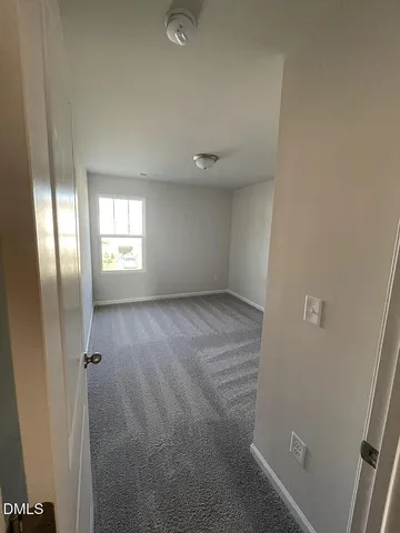 a living room with a bed and a table