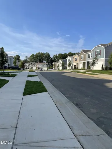 a view of swimming pool with outdoor seating and yard