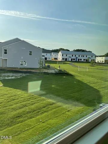 a view of a big yard with a large pool