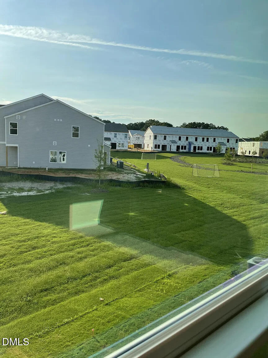 930 Field Ivy Drive Fuquay-Varina, NC 27526 - Photo 4 of 29 a view of swimming pool with outdoor seating and yard