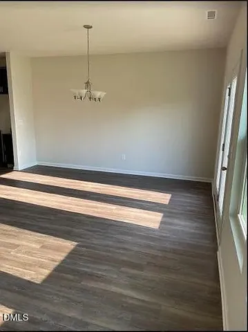 a view of a livingroom from a hallway