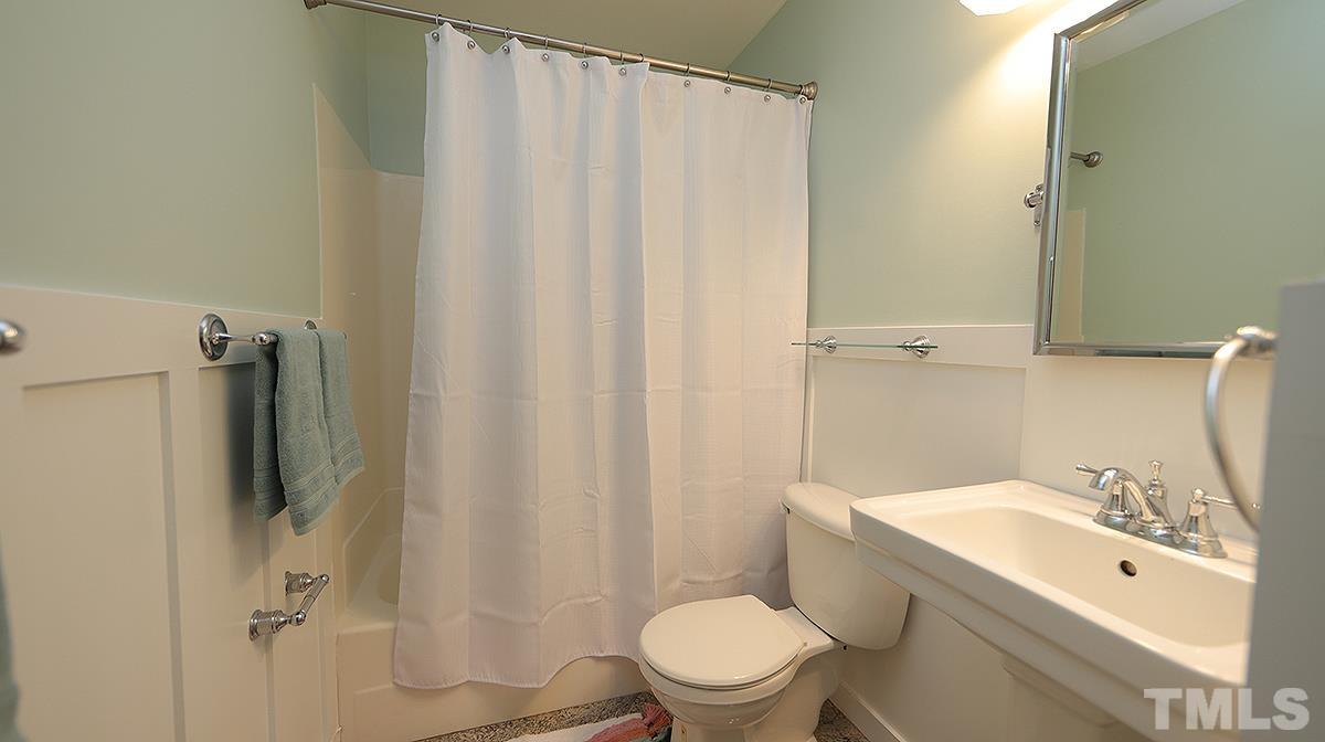 2208 Stafford Avenue, Unit 202 Raleigh, NC 27607 - Photo 12 of 15 a bathroom with a sink toilet and shower