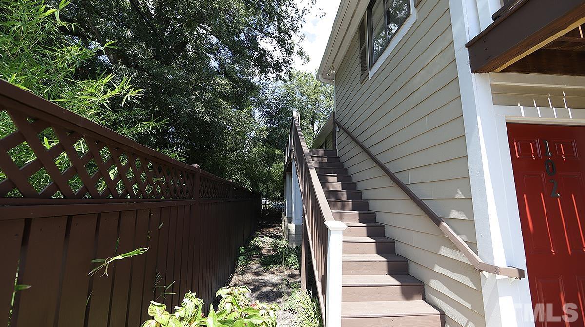 2208 Stafford Avenue, Unit 202 Raleigh, NC 27607 - Photo 2 of 15 a view of balcony with wooden floor and fence and a pot