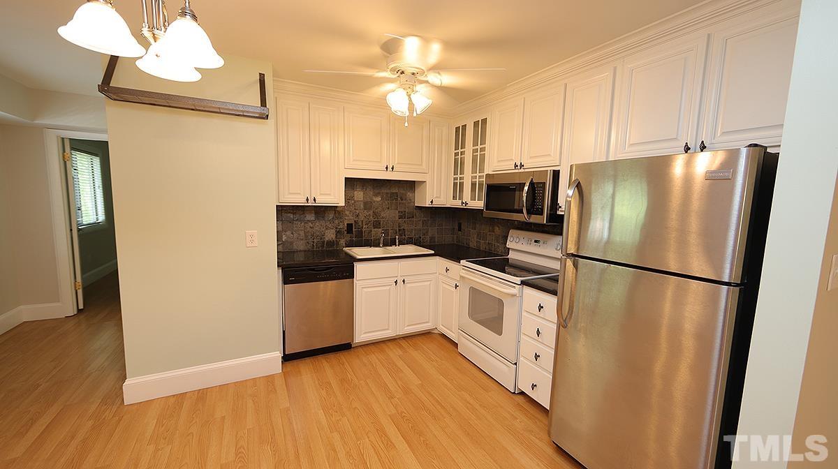 2208 Stafford Avenue, Unit 202 Raleigh, NC 27607 - Photo 7 of 15 a kitchen with a refrigerator a sink and dishwasher