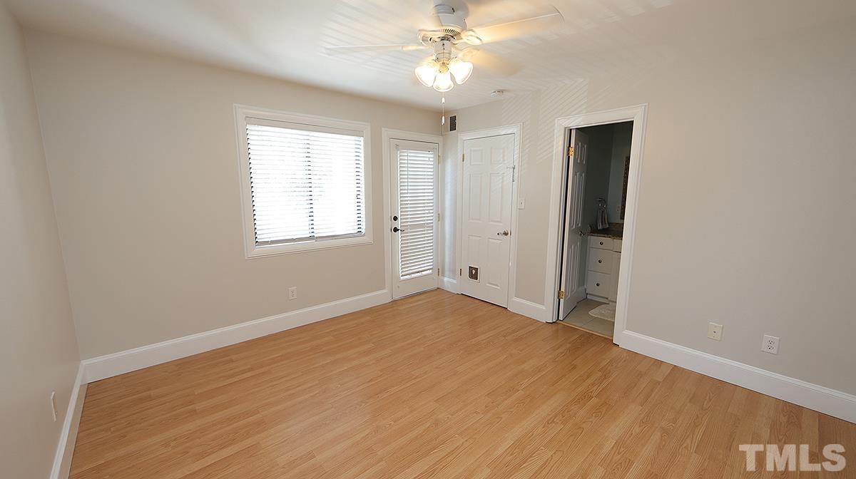 2208 Stafford Avenue, Unit 202 Raleigh, NC 27607 - Photo 9 of 15 wooden floor in an empty room with a window
