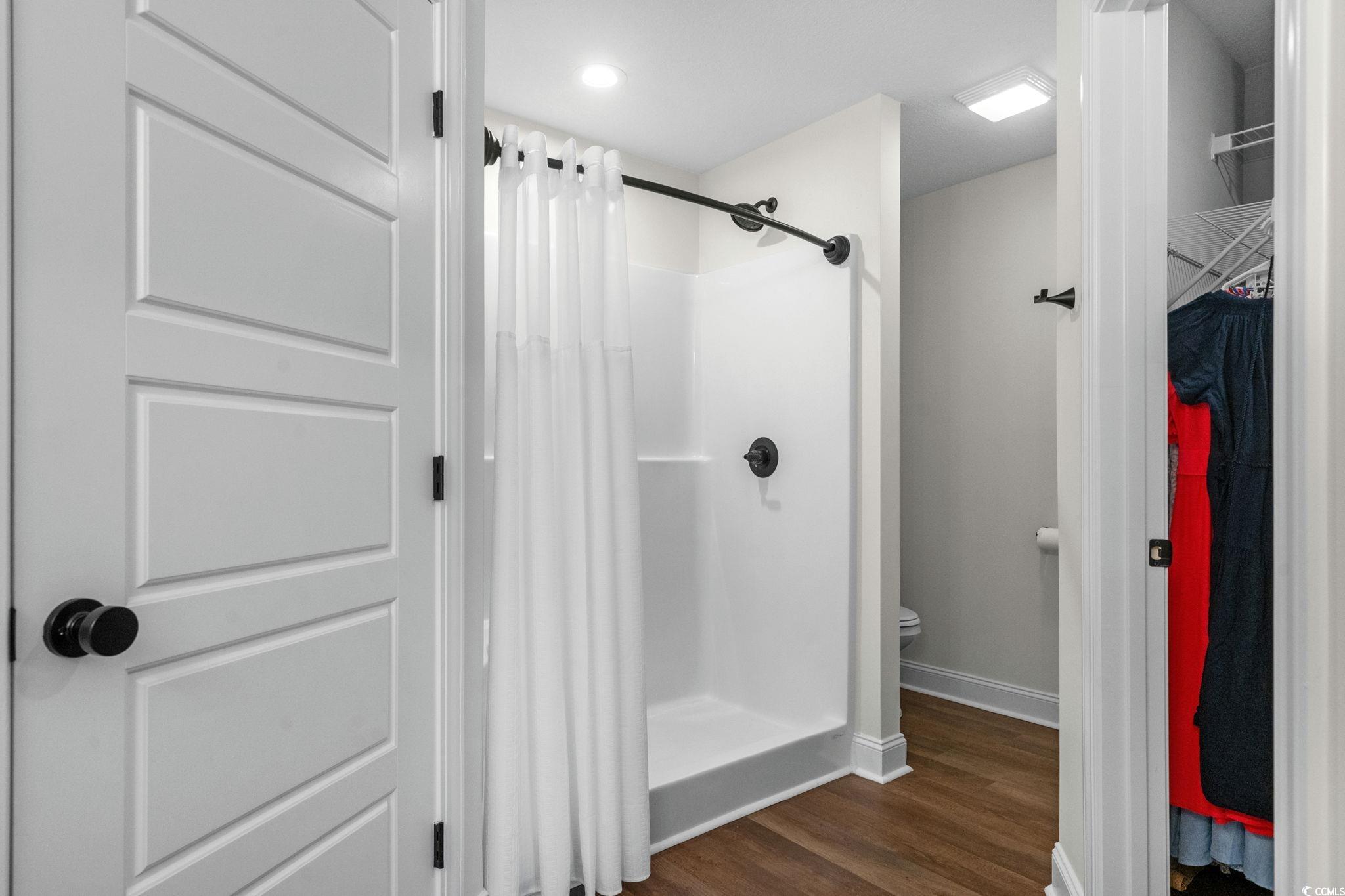 6782 Highway 366 Conway, SC 29526 - Photo 13 of 37 Bedroom featuring a raised ceiling, dark wood-type flooring, and ceiling fan