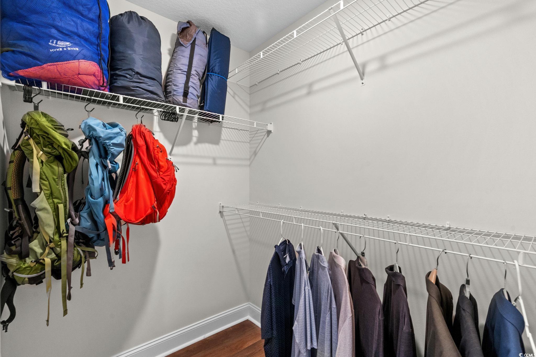 6782 Highway 366 Conway, SC 29526 - Photo 15 of 37 Full bath featuring double vanity, dark wood-style flooring, and a textured ceiling