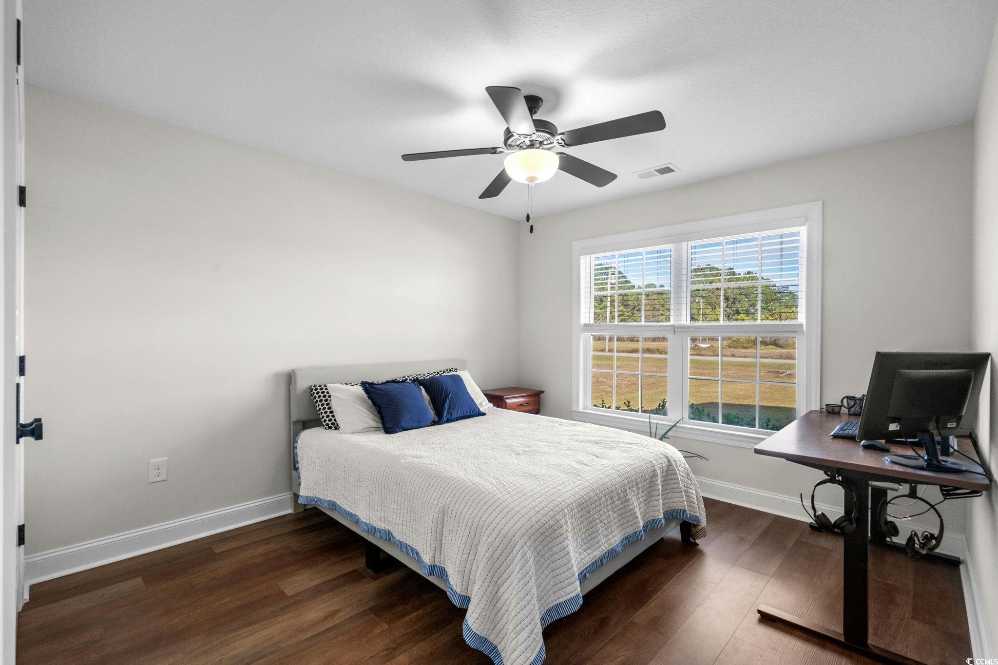 6782 Highway 366 Conway, SC 29526 - Photo 19 of 37 Bedroom featuring a textured ceiling, light wood-style flooring, and ceiling fan