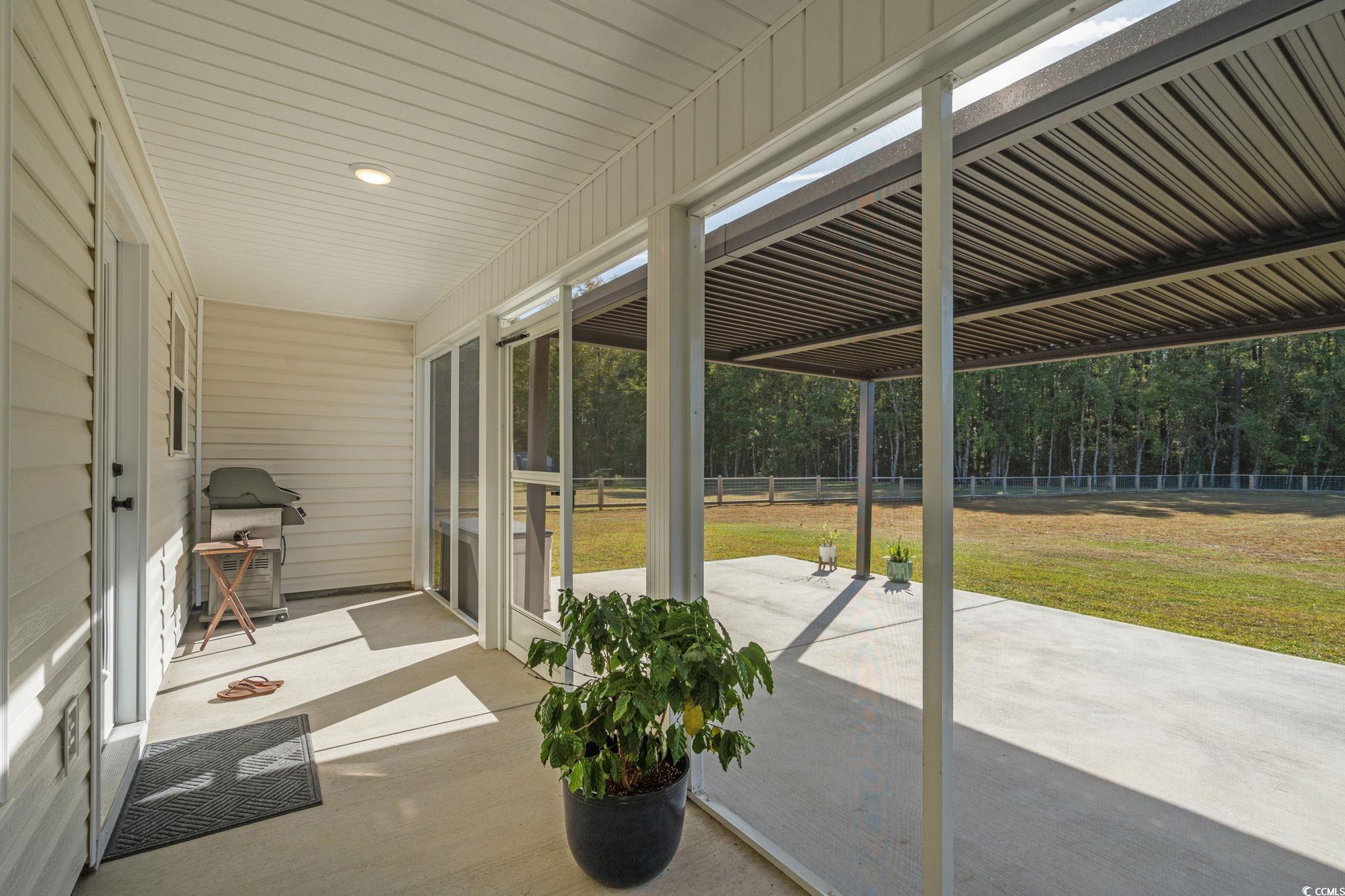 6782 Highway 366 Conway, SC 29526 - Photo 22 of 37 Bedroom with dark wood finished floors, ceiling fan, and a desk