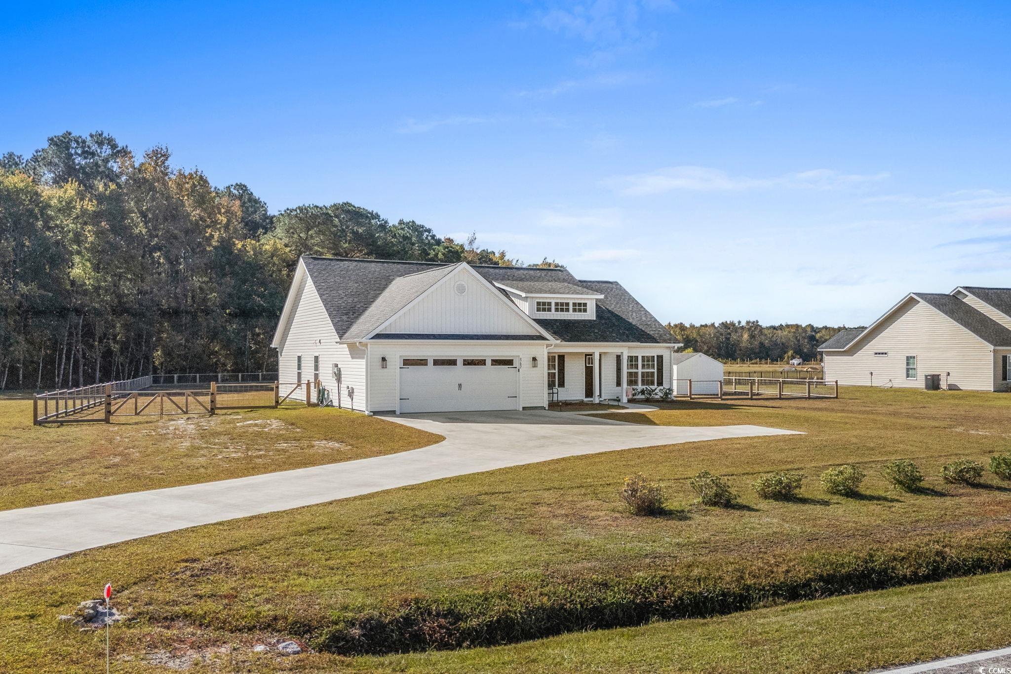 6782 Highway 366 Conway, SC 29526 - Photo 30 of 37 Rear view of house with a patio area, a fenced backyard, and roof with shingles