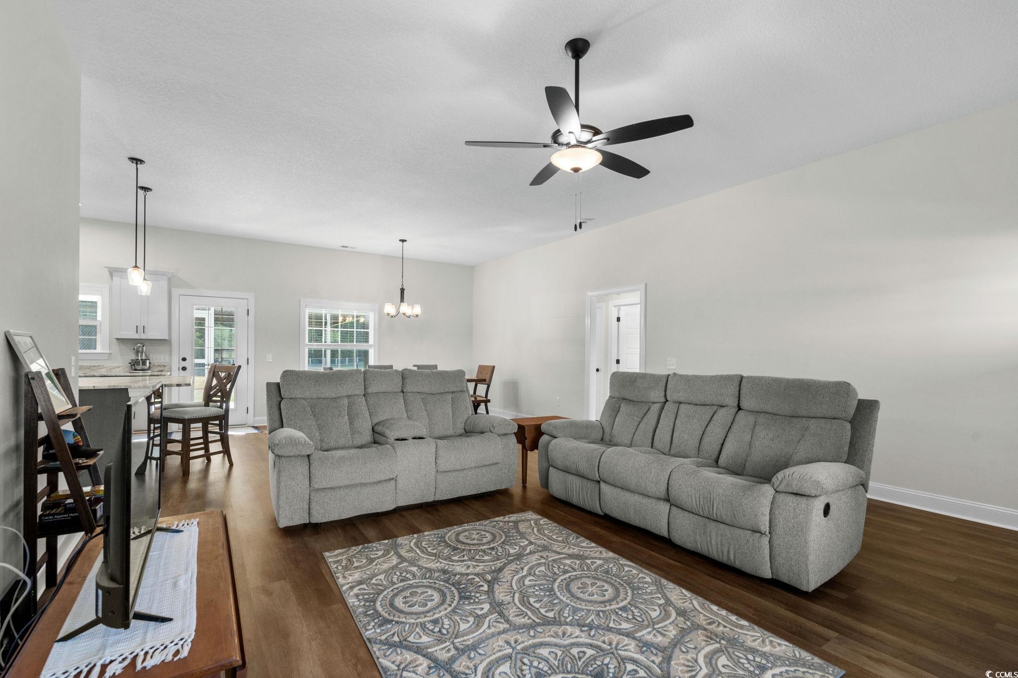 6782 Highway 366 Conway, SC 29526 - Photo 5 of 37 Living room with dark wood finished floors, a chandelier, a ceiling fan, and a textured ceiling