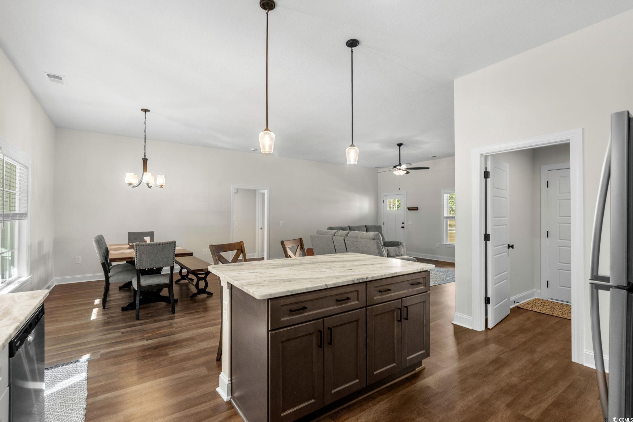 6782 Highway 366 Conway, SC 29526 - Photo 9 of 37 Kitchen with appliances with stainless steel finishes, white cabinetry, dark wood finished floors, and light stone counters