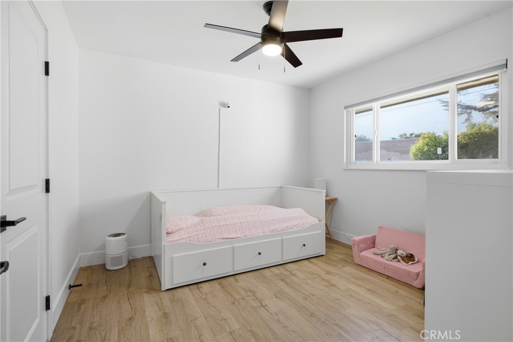 384 Colorado Street Arcadia, CA 91007 - Photo 44 of 51 a bedroom with a bed and a chandelier
