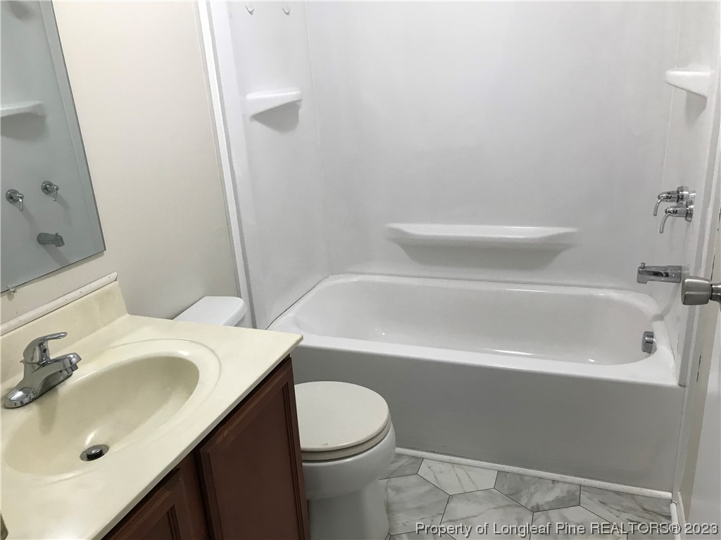 2046 Wade-Stedman Road Stedman, NC 28391 - Photo 9 of 17 a bathroom with a sink toilet and shower