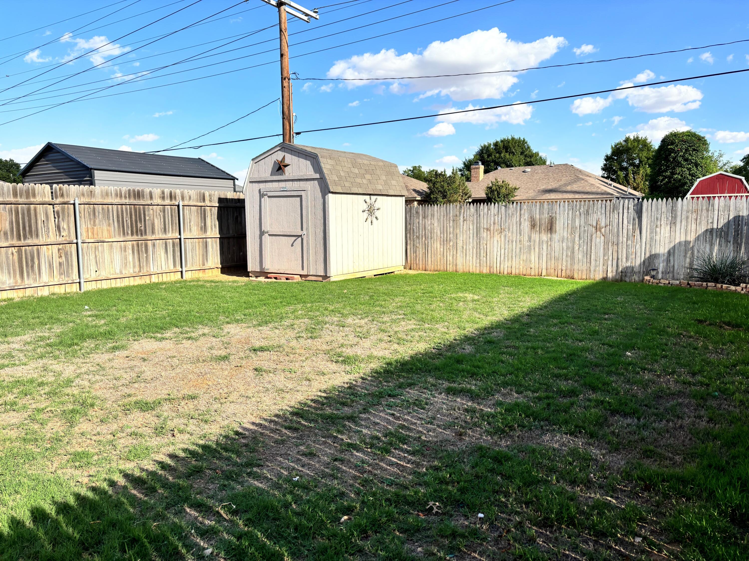 3713 106th Street Lubbock, TX 79423 - Photo 20 of 22 a view of a backyard with plants and outdoor seating