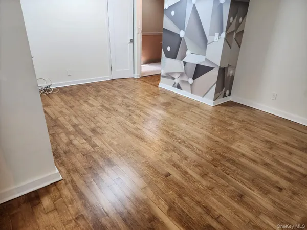 an entryway with wooden floor