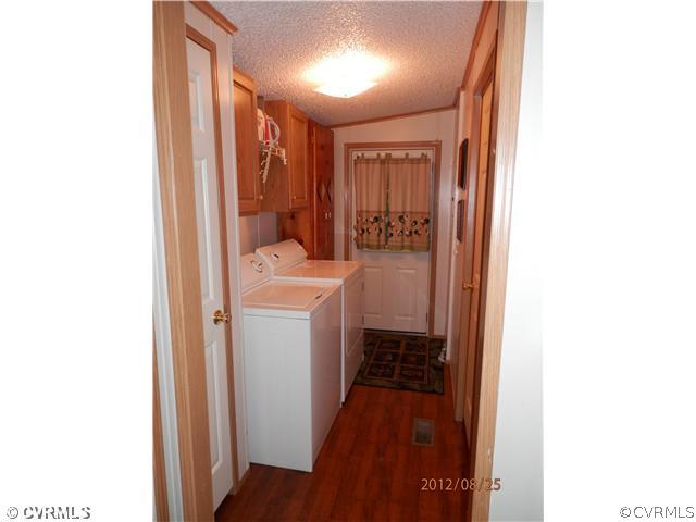 3415 Wickham Road Bumpass, VA 23024 - Photo 8 of 12 a bathroom with a sink and a mirror