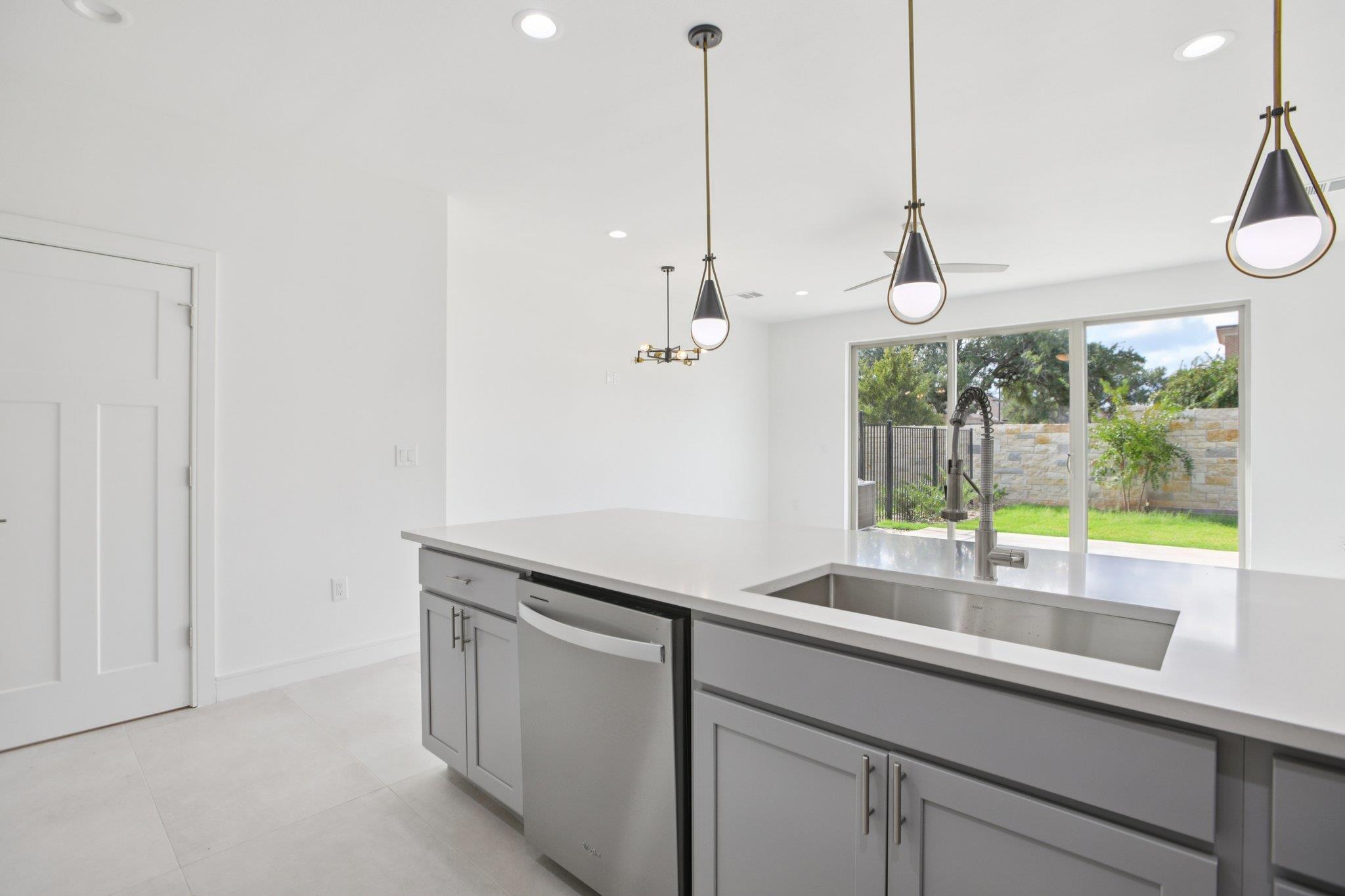 302 Tesla Circle Austin, TX 78681 - Photo 14 of 40 a kitchen with a sink and a window