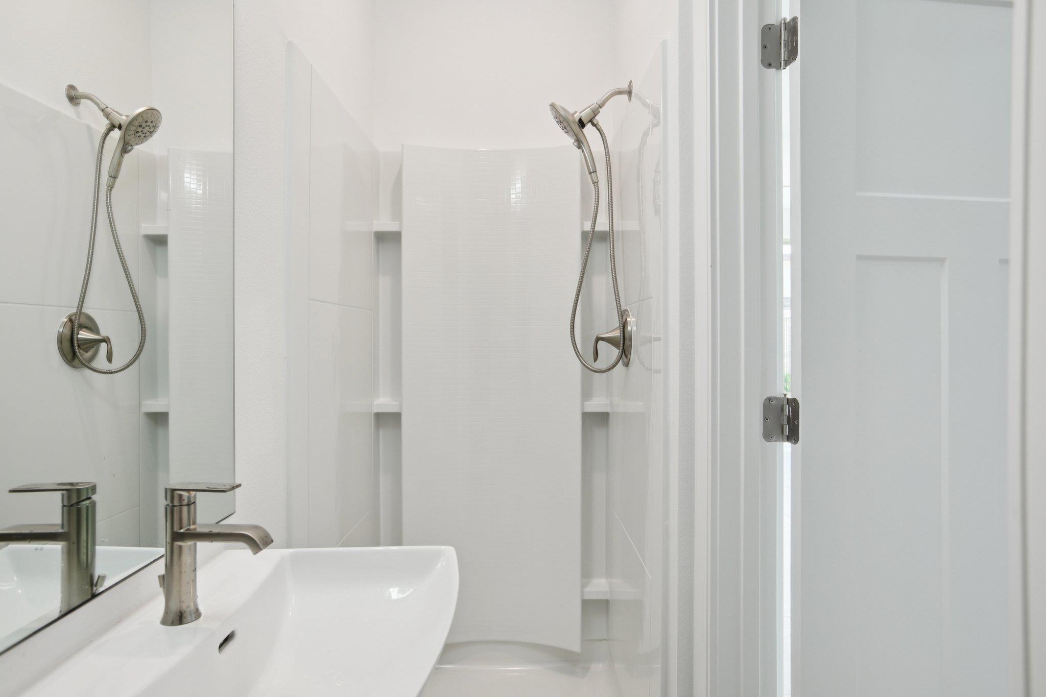 302 Tesla Circle Austin, TX 78681 - Photo 17 of 40 a bathroom with a shower and a shower