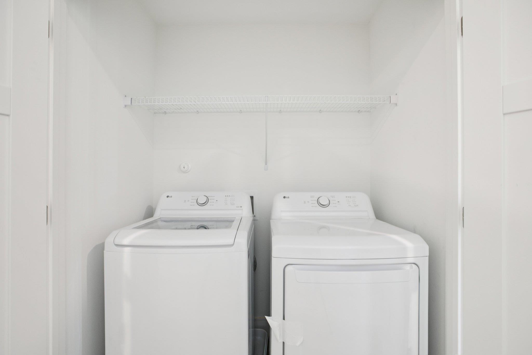 302 Tesla Circle Austin, TX 78681 - Photo 20 of 40 a utility room with dryer and washer