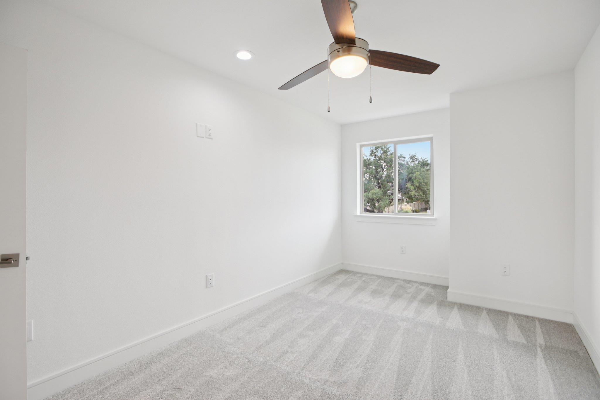 302 Tesla Circle Austin, TX 78681 - Photo 27 of 40 an empty room with a window