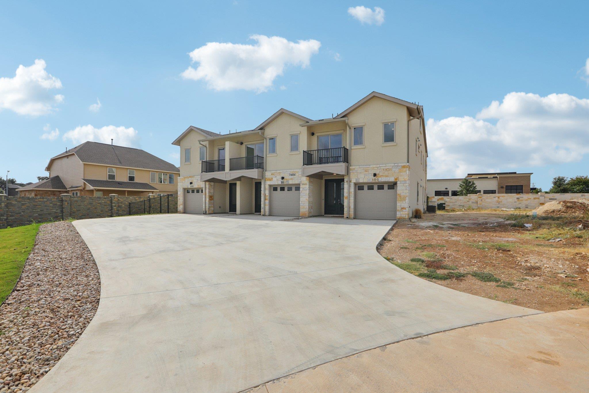 302 Tesla Circle Austin, TX 78681 - Photo 3 of 40 a view of a white house with a yard